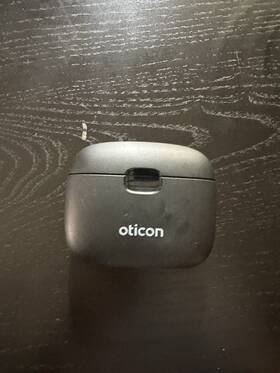 More3 Oticon Hearing Aid And Charger