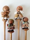 4 Hand Carved Wood Swiss German Alpine Musicians Figurines On Dowels Barware 8"T. Fixed Price $27.50.