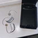 Pair Of Oticon Ria 2 Pro Hearing Aids With Case. Fixed Price $150.00.