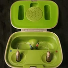 Phonak I90 Hearing Aids, Silver & Green Charger Case Cable. Fixed Price $1750.00.