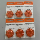 Amazonbasics Size 13 (orange) Zinc-air Hearing Aid Batteries 1.45V 6-PACK. Fixed Price $12.99.