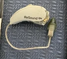 Resound Gn Hearing Aid W/ Charging Base Left Only. Fixed Price $95.00.