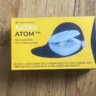 Audien Atom One Rechargeable Cic Hearing Aid Beige With Charging Dock. Fixed Price $40.00.